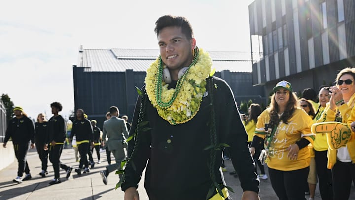 Oct 4, 2024; Eugene, Oregon, USA; Oregon Ducks quarterback Dillon Gabriel (8) visits with family and fans before a game against the Michigan State Spartans at Autzen Stadium. Mandatory Credit: Troy Wayrynen-Imagn Images