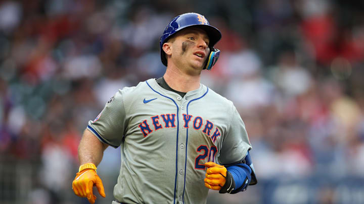 Sep 30, 2024; Atlanta, Georgia, USA; New York Mets first baseman Pete Alonso (20) hits a single against the Atlanta Braves in the fifth inning at Truist Park. Mandatory Credit: Brett Davis-Imagn Images
