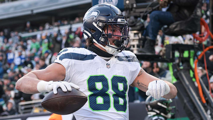 Dec 1, 2024; East Rutherford, New Jersey, USA; Seattle Seahawks tight end AJ Barner (88) celebrates after scoring a touchdown during the first half against the New York Jets at MetLife Stadium.