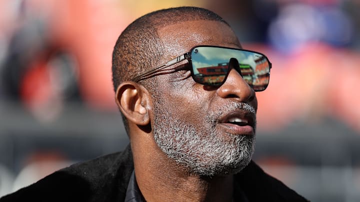 Dec 21, 2025; Cleveland, Ohio, USA;  Legendary  football and baseball player and father of Cleveland Browns quarterback Shedeur Sanders, Deion Sanders on the sidelines prior to a game against the Buffalo Bills at Huntington Bank Field. Mandatory Credit: Scott Galvin-Imagn Images
