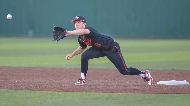 Lucas Lovejoy shortstop Carson Branch reaches for a throw during a game against Melissa earlier this season.