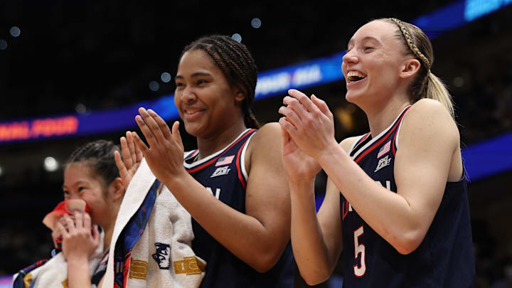 UConn Huskies forward Sarah Strong and guard Paige Bueckers react to a play on the bench during the Final Four.