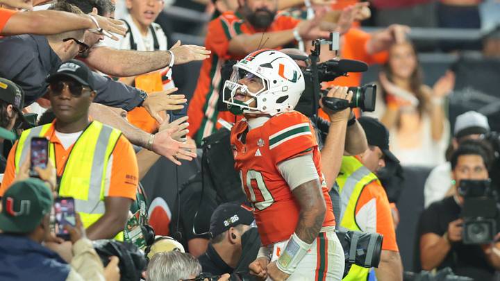 Oct 17, 2026; Miami Gardens, Florida, USA; Miami Hurricanes quarterback Darian Mensah (10) celebrates after a two-point conversion during overtime against the Florida State Seminoles at Hard Rock Stadium. Mandatory Credit: Sam Navarro-Imagn Images Oct 17, 2026; Miami Gardens, Florida, USA; Miami Hurricanes quarterback Darian Mensah (10) celebrates after a two-point conversion during overtime against the Florida State Seminoles at Hard Rock Stadium. Mandatory Credit: Sam Navarro-Imagn Images