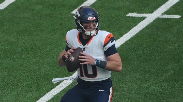 Oct 12, 2025; Tottenham, United Kingdom; Denver Broncos quarterback Bo Nix (10) drops back to pass against the New York Jets during an NFL International Series game at Tottenham Hotspur Stadium.  