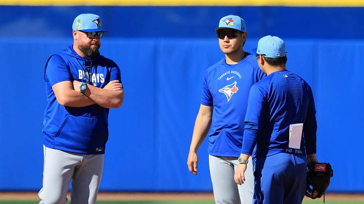 Feb 16, 2026; Dunedin, FL, USA; Toronto Blue Jays manager John Schneider (14) talks with infielder Kazuma Okamoto (7) during spring training practice at Player Development Complex. Mandatory Credit: Kim Klement Neitzel-Imagn Images