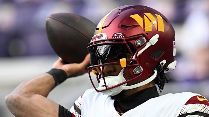 Washington Commanders quarterback Jayden Daniels practices before the game at U.S. Bank Stadium. Washington Commanders quarterback Jayden Daniels practices before the game at U.S. Bank Stadium.