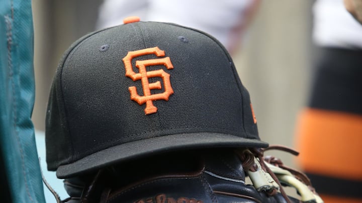Jul 14, 2023; Pittsburgh, Pennsylvania, USA;  San Francisco Giants hat and glove on the bench against the Pittsburgh Pirates during the first inning at PNC Park. 