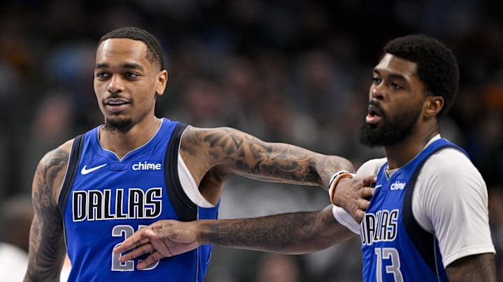 Jan 17, 2025; Dallas, Texas, USA; Dallas Mavericks forward P.J. Washington (25) and forward Naji Marshall (13) celebrate during the second quarter against the Oklahoma City Thunder at the American Airlines Center. Mandatory Credit: Jerome Miron-Imagn Images
