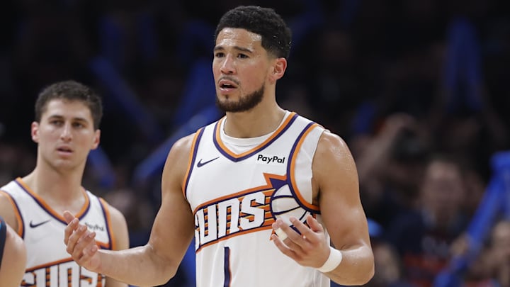Apr 22, 2026; Oklahoma City, Oklahoma, USA; Phoenix Suns guard Devin Booker (1) reacts after receiving a technical after a play against the Oklahoma City Thunder in the second half during game two of the first round of the 2026 NBA Playoffs at Paycom Center. Mandatory Credit: Alonzo Adams-Imagn Images