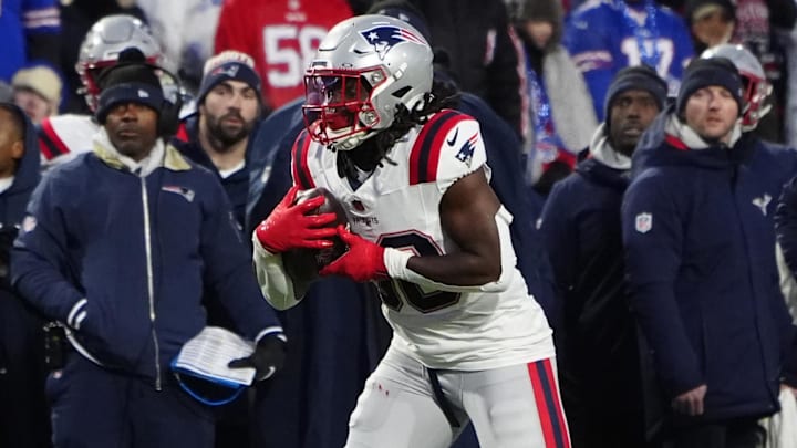Dec 22, 2024; Orchard Park, New York, USA; New England Patriots running back Rhamondre Stevenson (38) runs with the ball after making a catch against the Buffalo Bills during the first half at Highmark Stadium. Mandatory Credit: Gregory Fisher-Imagn Images