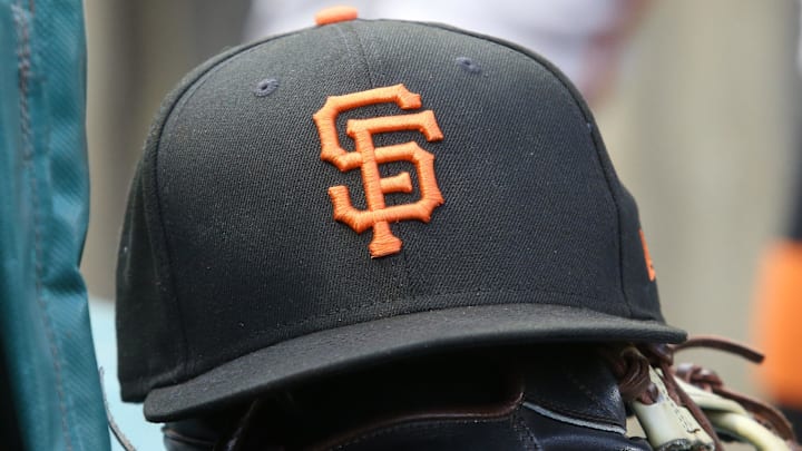 Jul 14, 2023; Pittsburgh, Pennsylvania, USA;  San Francisco Giants hat and glove on the bench against the Pittsburgh Pirates during the first inning at PNC Park. 
