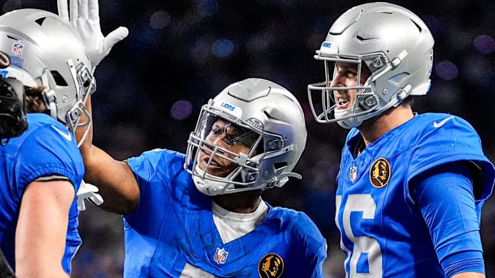 Detroit Lions WR Isaac TeSlaa (18) celebrates a touchdown against against Packers with RB David Montgomery (5)