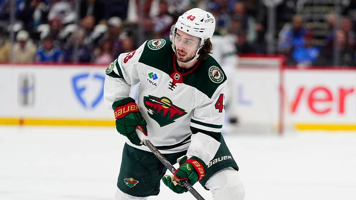 May 5, 2026; Denver, Colorado, USA; Minnesota Wild defenseman Quinn Hughes (43) prepares to shoot the puck against the Colorado Avalanche in game two of the second round of the 2026 Stanely Cup Playoffs at Ball Arena. Mandatory Credit: Ron Chenoy-Imagn Images