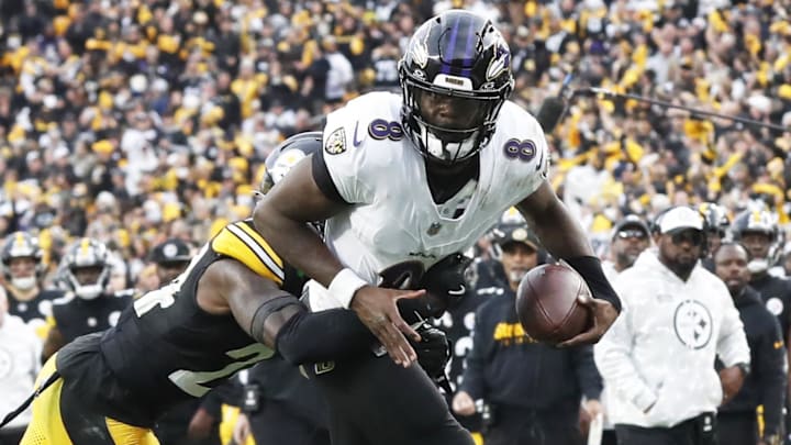 Nov 17, 2024; Pittsburgh, Pennsylvania, USA;  Pittsburgh Steelers cornerback Joey Porter Jr. (24) stops Baltimore Ravens quarterback Lamar Jackson (8) short of the end-zone on a two point conversion attempt during the fourth quarter at Acrisure Stadium. Mandatory Credit: Charles LeClaire-Imagn Images