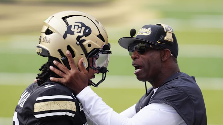 Aug 29, 2025; Boulder, Colorado, USA; Colorado Buffaloes head coach Deion Sanders congratulates Colorado Buffaloes quarterback Kaidon Salter (3) following a touchdown pass in the first quarter against the Georgia Tech Yellow Jackets at Folsom Field. Mandatory Credit: Ron Chenoy-Imagn Images