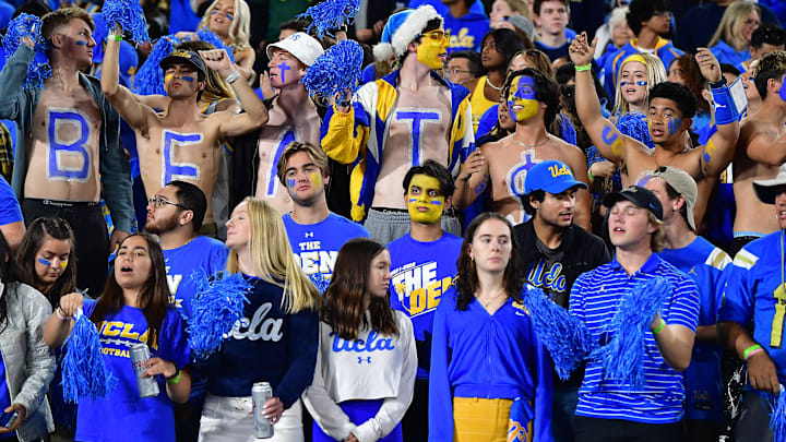 Nov 19, 2022; Pasadena, California, USA; UCLA Bruins student fan section cheers against the Southern California Trojans during the first half at the Rose Bowl. Mandatory Credit: Gary A. Vasquez-Imagn Images Nov 19, 2022; Pasadena, California, USA; UCLA Bruins student fan section cheers against the Southern California Trojans during the first half at the Rose Bowl. Mandatory Credit: Gary A. Vasquez-Imagn Images