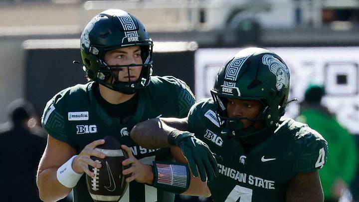 Michigan State quarterback Alessio Milivojevic (11) fakes a handoff to running back Jaziun Patterson (4) and looks to throw against Northwestern at Spartan Stadium on Saturday, Oct. 17, 2026 Michigan State quarterback Alessio Milivojevic (11) fakes a handoff to running back Jaziun Patterson (4) and looks to throw against Northwestern at Spartan Stadium on Saturday, Oct. 17, 2026