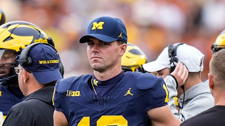 Michigan quarterback Jack Tuttle (13) at a timeout against Texas during the first half at Michigan Stadium in Ann Arbor on Saturday, September 7, 2024.