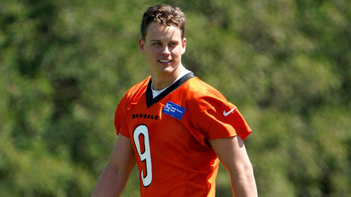 Cincinnati Bengals quarterback Joe Burrow (9) smiles during practice, Tuesday, May 17, 2022, at the Paul Brown Stadium practice fields in Cincinnati.

Cincinnati Bengals Practice May 17 0095