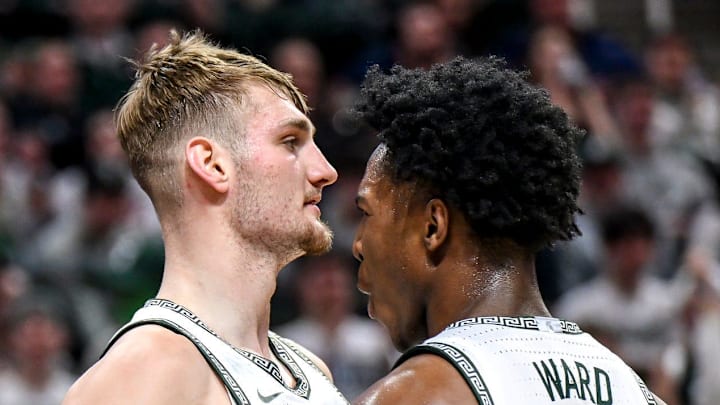 Michigan State's Carson Cooper, left, celebrates after sorting and drawing a UCLA with teammate Cam Ward during the first half on Tuesday, Feb. 17, 2026, at the Breslin Center in East Lansing.