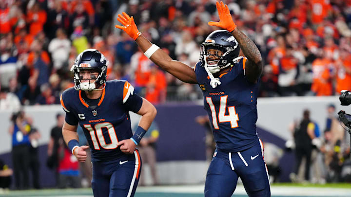 Sep 29, 2025; Denver, Colorado, USA; Denver Broncos wide receiver Courtland Sutton (14) celebrates after scoring a touchdown  on a pass from Denver Broncos quarterback Bo Nix (10) during the second quarter against the Cincinnati Bengals at Empower Field at Mile High. 