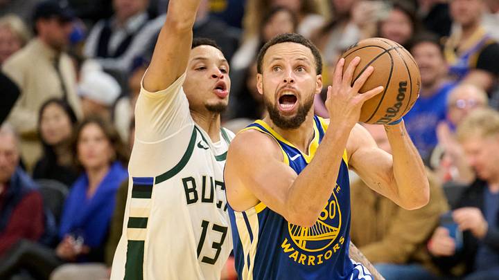 Jan 7, 2026; San Francisco, California, USA; Golden State Warriors guard Stephen Curry (30) drives to the basket against Milwaukee Bucks guard Ryan Rollins (13) during the fourth quarter at Chase Center. Mandatory Credit: Robert Edwards-Imagn Images Jan 7, 2026; San Francisco, California, USA; Golden State Warriors guard Stephen Curry (30) drives to the basket against Milwaukee Bucks guard Ryan Rollins (13) during the fourth quarter at Chase Center. Mandatory Credit: Robert Edwards-Imagn Images