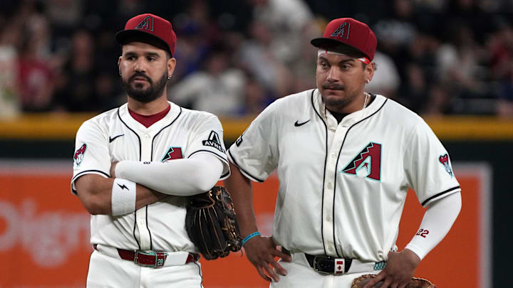 Jun 9, 2025; Phoenix, Arizona, USA; Arizona Diamondbacks third base Eugenio Suarez (28) and first base Josh Naylor (22) talk in the ninth inning against the Seattle Mariners at Chase Field. Mandatory Credit: Rick Scuteri-Imagn Images
