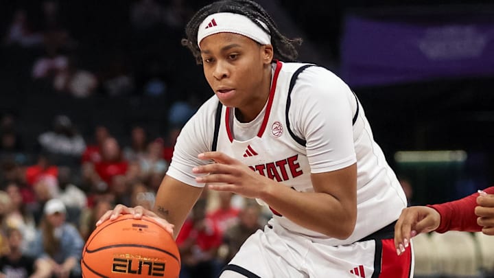 Nov 9, 2025; Charlotte, North Carolina, USA;  NC State Wolfpack guard Zoe Brooks (35) drives the ball against the Southern California Trojans during the second quarter of the Ally Tipoff game at Spectrum Center. Mandatory Credit: Cory Knowlton-Imagn Images
