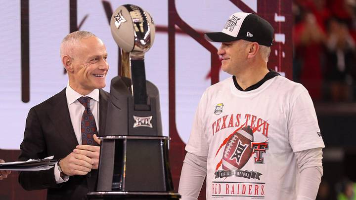 Texas Tech head coach Joey McGuire stands with commissioner Brett Yormark (middle) and ESPN's Katie Georgie after winning Big 12 Championship football game, Saturday, Nov. 6, 2025, at AT&T Stadium in Arlington. Texas Tech head coach Joey McGuire stands with commissioner Brett Yormark (middle) and ESPN's Katie Georgie after winning Big 12 Championship football game, Saturday, Nov. 6, 2025, at AT&T Stadium in Arlington.