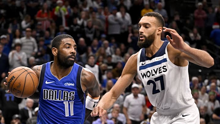 Dec 25, 2024; Dallas, Texas, USA; Dallas Mavericks guard Kyrie Irving (11) and Minnesota Timberwolves center Rudy Gobert (27) in action during the game between the Dallas Mavericks and the Minnesota Timberwolves at the American Airlines Center. Mandatory Credit: Jerome Miron-Imagn Images