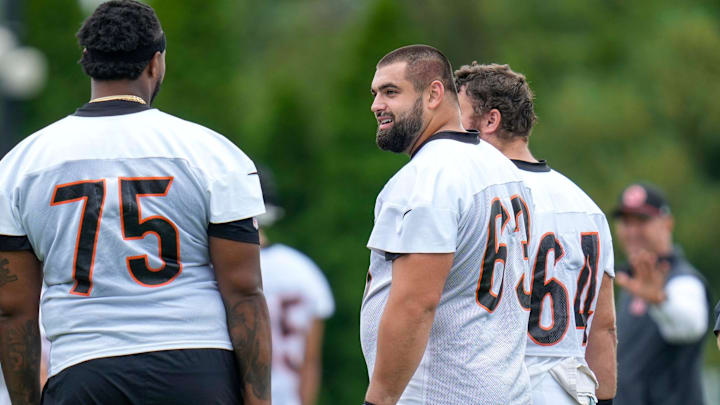 Cincinnati Bengals guard Dylan Fairchild (63) talks with offensive tackle Orlando Brown Jr. (75) during practice at the Paycor Stadium practice field in downtown Cincinnati on Wednesday, Aug. 20, 2025. Cincinnati Bengals guard Dylan Fairchild (63) talks with offensive tackle Orlando Brown Jr. (75) during practice at the Paycor Stadium practice field in downtown Cincinnati on Wednesday, Aug. 20, 2025.