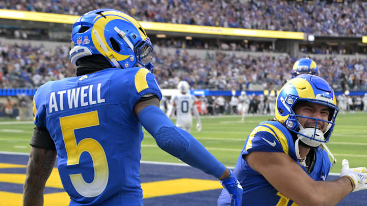Sep 28, 2025; Inglewood, California, USA; Los Angeles Rams wide receiver Tutu Atwell (5) is congratulated by wide receiver Puka Nacua (12) after he ran for a touchdown on an 88-yard pass play in the fourth quarter against the Indianapolis Colts at SoFi Stadium. Mandatory Credit: Jayne Kamin-Oncea-Imagn Images