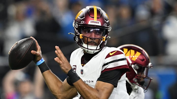 Washington Commanders quarterback Jayden Daniels (5) throws a pass during the first quarter against Detroit Lions in a 2025 NFC divisional round game at Ford Field. Mandatory Credit: Lon Horwedel-Imagn Images