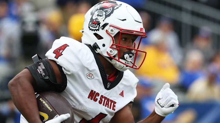 Oct 25, 2025; Pittsburgh, Pennsylvania, USA;  North Carolina State Wolfpack running back Jayden Scott (4) returns the opening kick-off against the Pittsburgh Panthers during the first quarter at Acrisure Stadium. Mandatory Credit: Charles LeClaire-Imagn Images