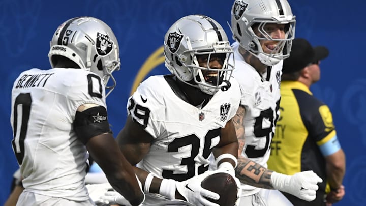 Oct 20, 2024; Inglewood, California, USA; Las Vegas Raiders cornerback Nate Hobbs (39) celebrates intercepting a Los Angeles Rams quarterback Matthew Stafford (not pictured) pass during the third quarter at SoFi Stadium. Left is Las Vegas Raiders cornerback Jakorian Bennett (0), right is defensive end Maxx Crosby (98). Mandatory Credit: Robert Hanashiro-Imagn Images Oct 20, 2024; Inglewood, California, USA; Las Vegas Raiders cornerback Nate Hobbs (39) celebrates intercepting a Los Angeles Rams quarterback Matthew Stafford (not pictured) pass during the third quarter at SoFi Stadium. Left is Las Vegas Raiders cornerback Jakorian Bennett (0), right is defensive end Maxx Crosby (98). Mandatory Credit: Robert Hanashiro-Imagn Images