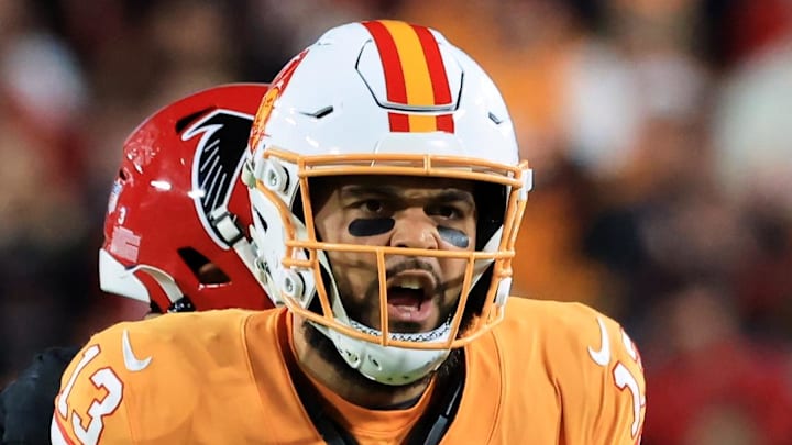 Dec 11, 2025; Tampa, Florida, USA; Tampa Bay Buccaneers wide receiver Mike Evans (13) reacts after catching a pass against Atlanta Falcons safety Jessie Bates III (3) (obscured) during the third quarter at Raymond James Stadium. Mandatory Credit: Kim Klement Neitzel-Imagn Images