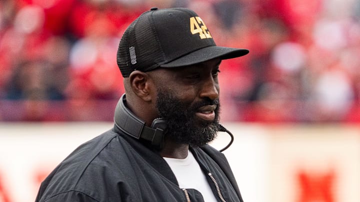 Nov 2, 2024; Lincoln, Nebraska, USA; UCLA Bruins head coach DeShaun Foster walks off after a timeout in the second quarter against the Nebraska Cornhuskers at Memorial Stadium. Mandatory Credit: Dylan Widger-Imagn Images