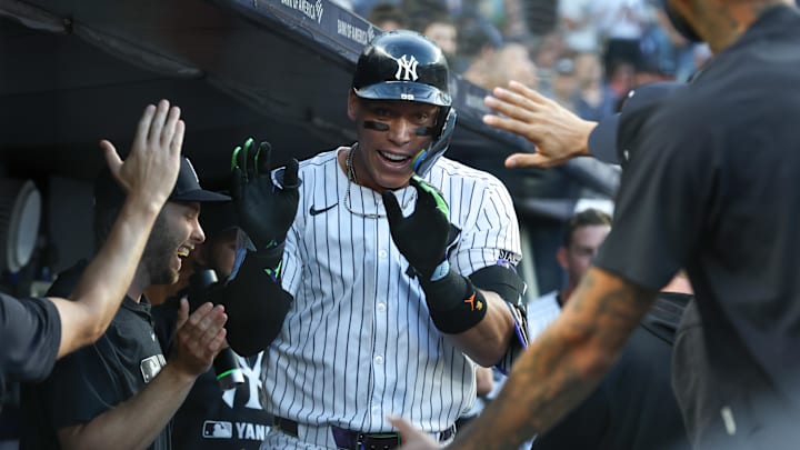 Aug 12, 2025; Bronx, New York, USA; New York Yankees designated hitter Aaron Judge (99) celebrates with teammates after hitting a solo home run during the first inning against Minnesota Twins starting pitcher Travis Adams (not pictured) at Yankee Stadium. Mandatory Credit: Vincent Carchietta-Imagn Images