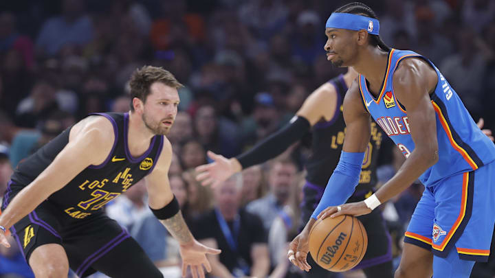  Shai Gilgeous-Alexander dribbles as Luka Doncic defends