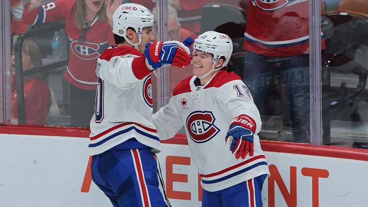 Dec 28, 2024; Sunrise, Florida, USA; Montreal Canadiens right wing Cole Caufield (13) celebrates with left wing Juraj Slafkovsky (20) after scoring against the Florida Panthers during the third period at Amerant Bank Arena. Mandatory Credit: Sam Navarro-Imagn Images