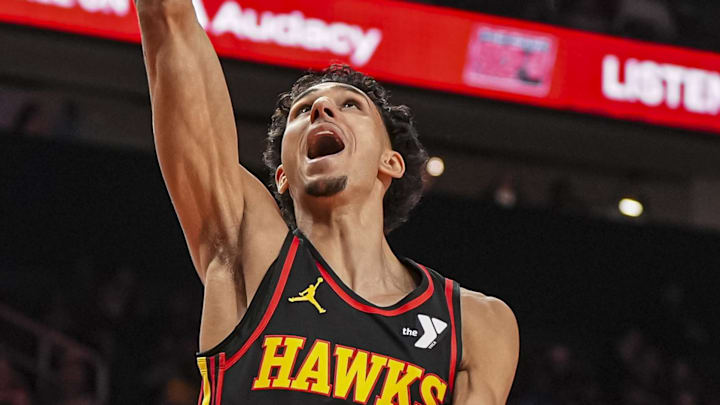 Apr 18, 2025; Atlanta, Georgia, USA; Atlanta Hawks forward Zaccharie Risacher (10) scores behind Miami Heat guard Alec Burks (18) during the first half at State Farm Arena. Mandatory Credit: Dale Zanine-Imagn Images