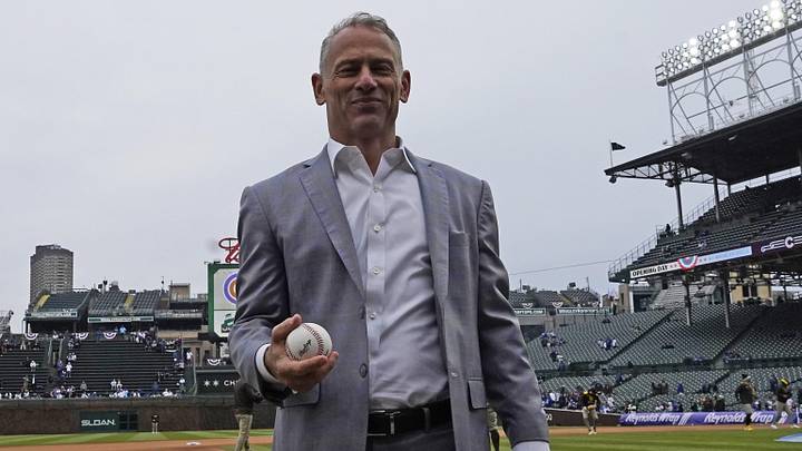 Apr 4, 2025; Chicago, Illinois, USA; Jed Hoyer President of the Chicago Cubs prepares to throw balls to fans before a game against the San Diego Padres at Wrigley Field. Mandatory Credit: David Banks-Imagn Images
