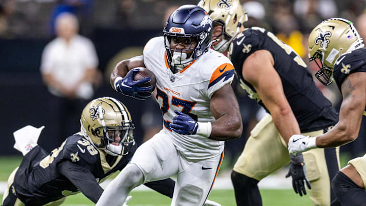 Aug 23, 2025; New Orleans, Louisiana, USA; Denver Broncos running back Audric Estime (23) runs against New Orleans Saints cornerback Jayden Price (38) during the second half at Caesars Superdome. Aug 23, 2025; New Orleans, Louisiana, USA; Denver Broncos running back Audric Estime (23) runs against New Orleans Saints cornerback Jayden Price (38) during the second half at Caesars Superdome.
