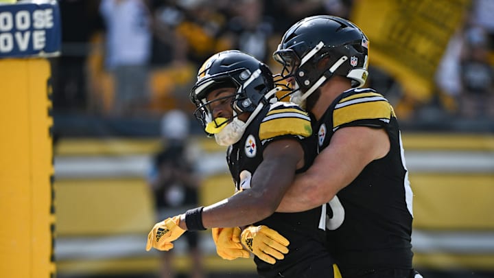 Sep 22, 2024; Pittsburgh, Pennsylvania, USA; Pittsburgh Steelers wide receiver Calvin Austin III (19) celebrates a touchdown with tight end Pat Freiermuth (88) during the fourth quarter against the Los Angeles Chargers  at Acrisure Stadium. Mandatory Credit: Barry Reeger-Imagn Images