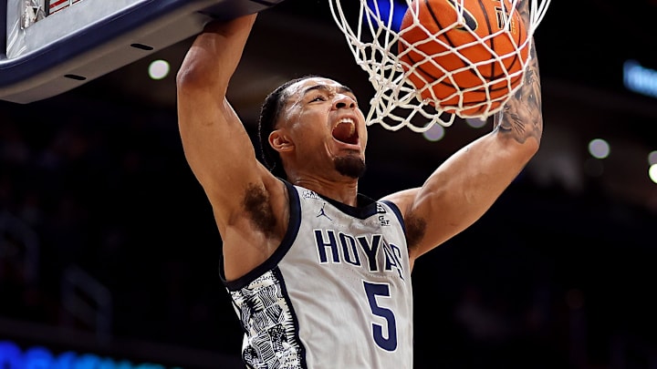 Feb 19, 2025; Washington, District of Columbia, USA; Georgetown Hoyas guard Micah Peavy (5) dunks during the first half against the Providence Friars at Capital One Arena. Mandatory Credit: Daniel Kucin Jr.-Imagn Images