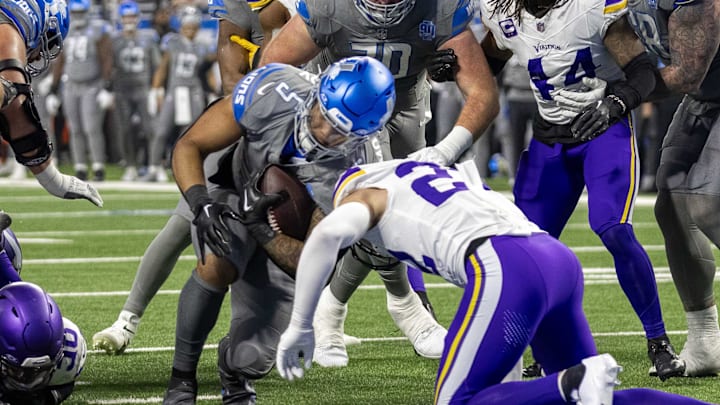 Detroit Lions running back David Montgomery (5) drives thru a tackle attempt by Vikings safety Harrison Smith (22) Detroit Lions running back David Montgomery (5) drives thru a tackle attempt by Vikings safety Harrison Smith (22)