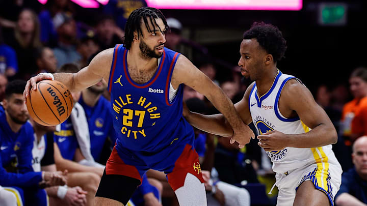 Mar 29, 2026; Denver, Colorado, USA; Denver Nuggets guard Jamal Murray (27) controls the ball as Golden State Warriors guard LJ Cryer (18) guards in the second quarter at Ball Arena. Mar 29, 2026; Denver, Colorado, USA; Denver Nuggets guard Jamal Murray (27) controls the ball as Golden State Warriors guard LJ Cryer (18) guards in the second quarter at Ball Arena.
