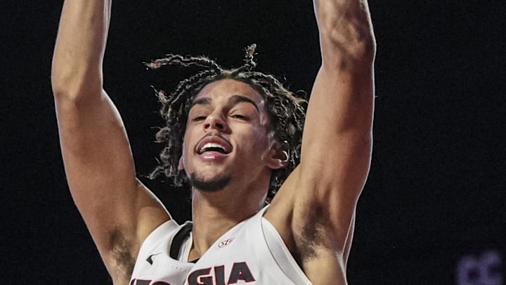 Dec 29, 2024; Athens, Georgia, USA; Georgia Bulldogs forward Asa Newell (14) dunks against the South Carolina State Bulldogs during the second half at Stegeman Coliseum. Mandatory Credit: Dale Zanine-Imagn Images