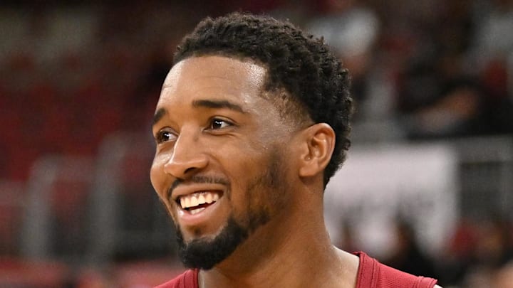 Cleveland Cavaliers guard Donovan Mitchell warms up and smiles prior to a game against the Chicago Bulls. Cleveland Cavaliers guard Donovan Mitchell warms up and smiles prior to a game against the Chicago Bulls.