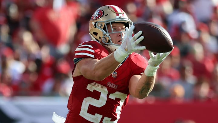 Nov 10, 2024; Tampa, Florida, USA; San Francisco 49ers running back Christian McCaffrey (23) catches the ball over Tampa Bay Buccaneers linebacker Lavonte David (54) during the second half at Raymond James Stadium. Mandatory Credit: Kim Klement Neitzel-Imagn Images Nov 10, 2024; Tampa, Florida, USA; San Francisco 49ers running back Christian McCaffrey (23) catches the ball over Tampa Bay Buccaneers linebacker Lavonte David (54) during the second half at Raymond James Stadium. Mandatory Credit: Kim Klement Neitzel-Imagn Images